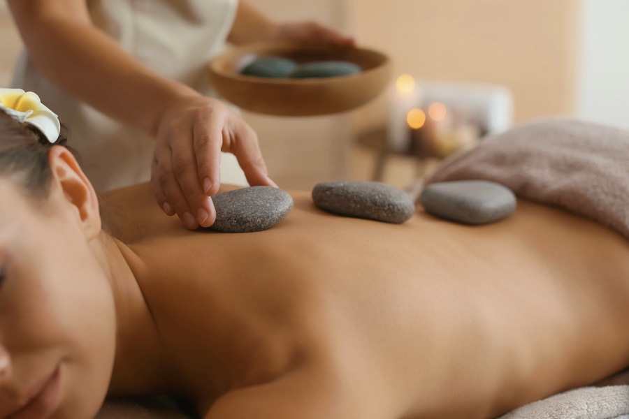 The Comprehensive History and Practice of Hot Stone Massage: A Timeless Healing Art